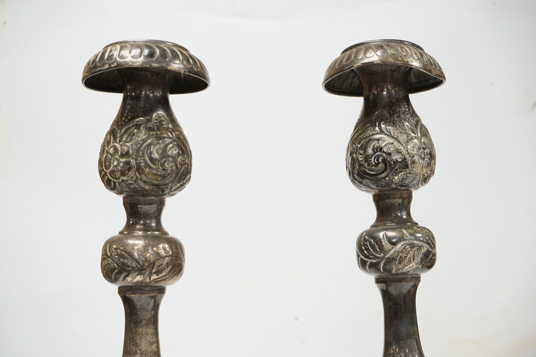 A pair of George V Sabbath Day silver candlesticks, by Joseph Zweig, London, 1914, 38cm, 31.7oz. Condition - poor to fair